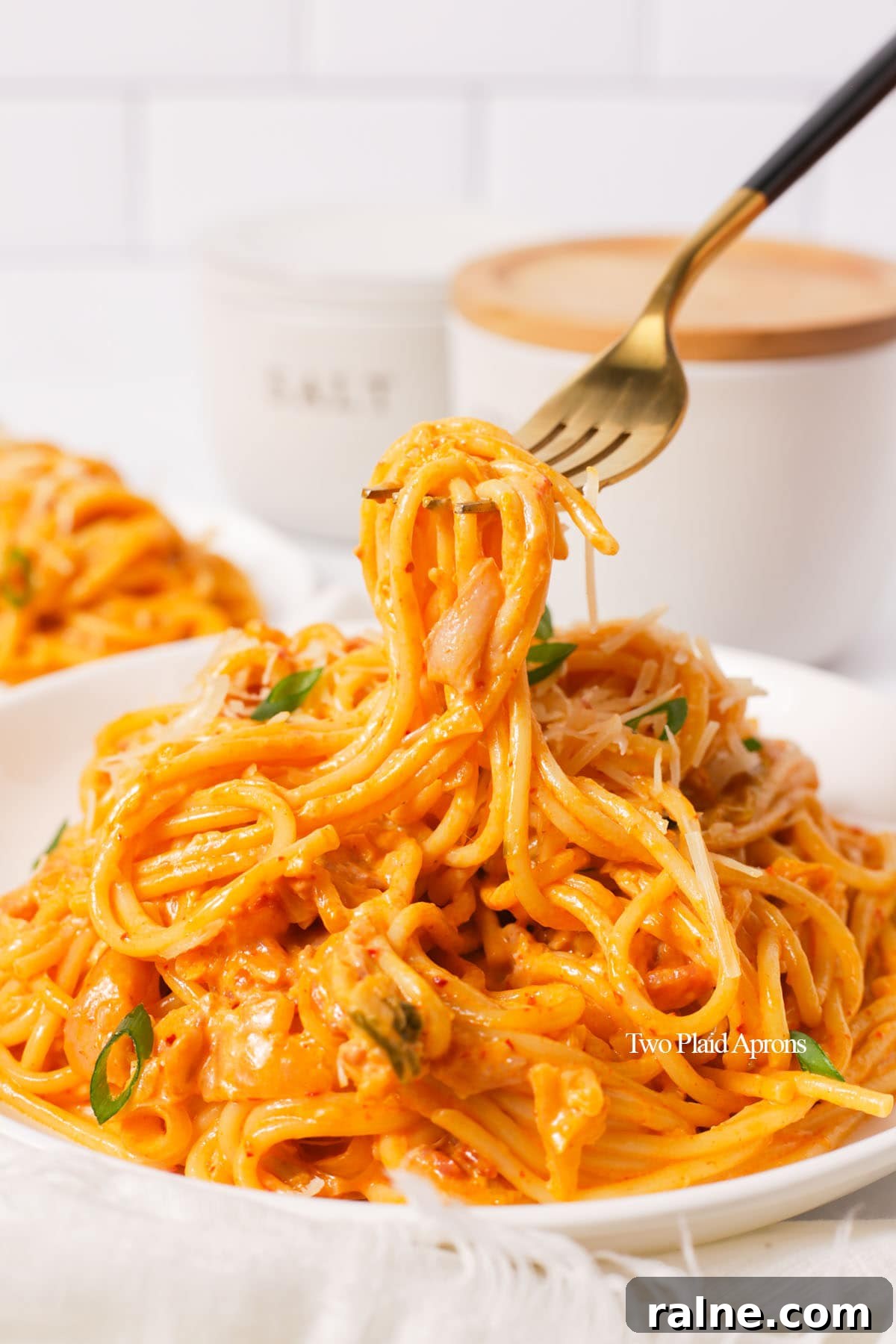 Napa Cabbage Kimchi Recipe: Authentic Homemade Kimchi Guide 5 Picking up creamy kimchi pasta with fork.