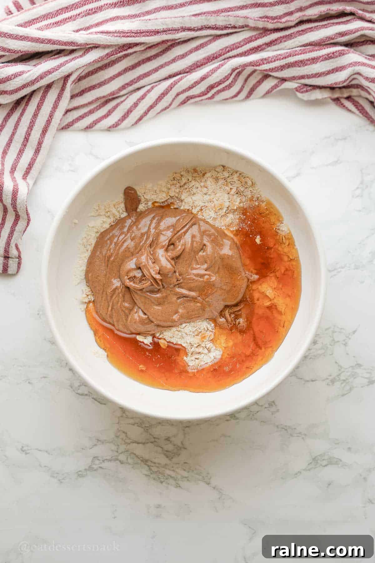 Almond Butter Protein Energy Bites for On-the-Go Snacks 5 Almond butter and honey in bowl.