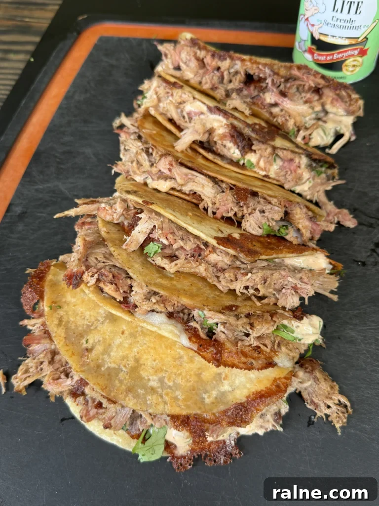 Cajun Pulled Pork Tacos with Creamy Slaw and Lime crema 2 cajun pulled pork tacos