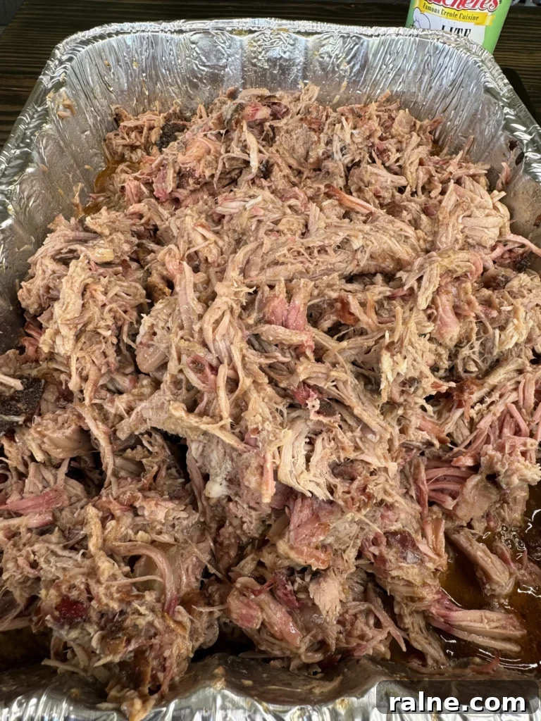 Cajun Pulled Pork Tacos with Creamy Slaw and Lime crema 3 pulled pork in a pan