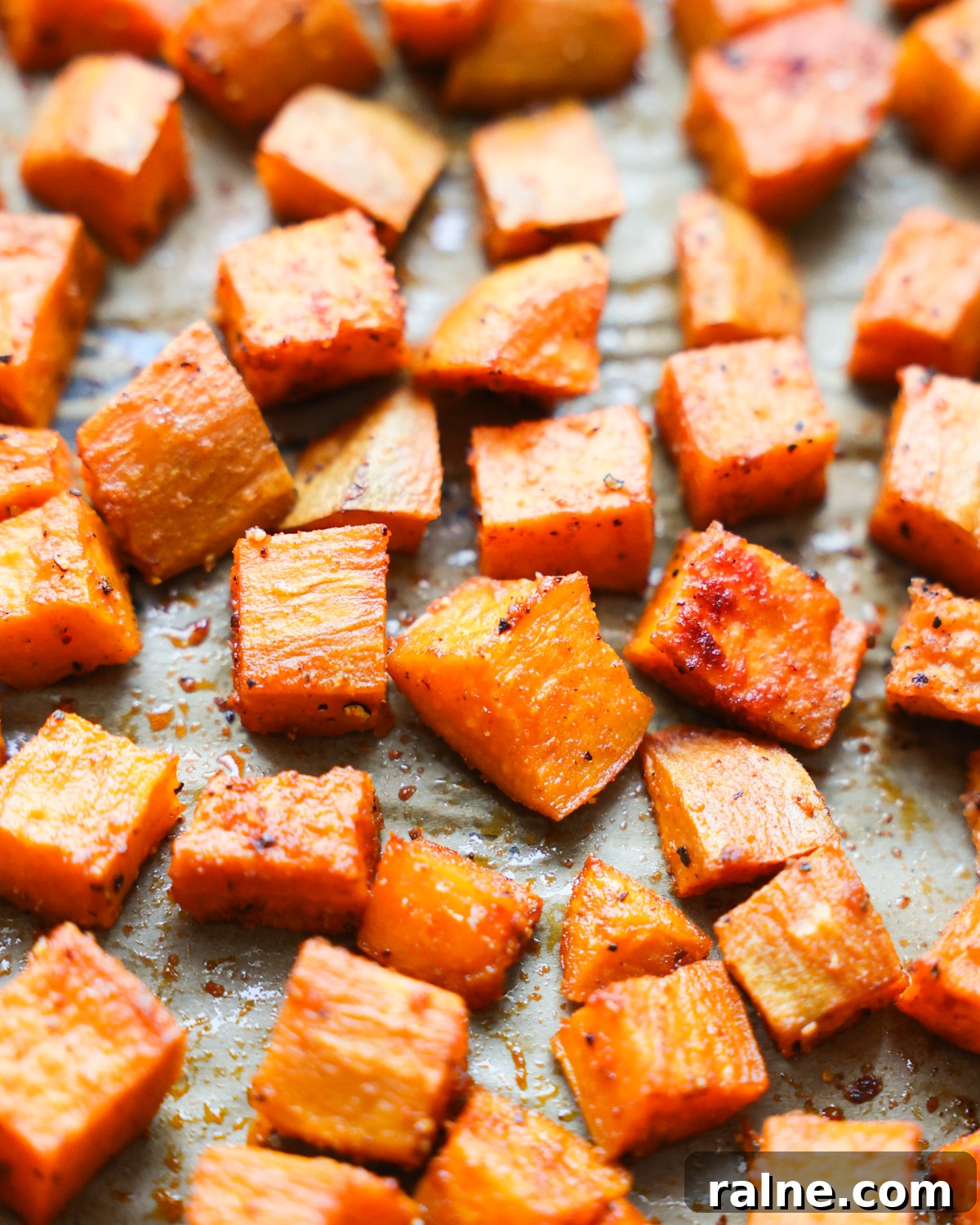 Delicious Sweet Potato Recipes for Every Meal 3 roasted sweet potatoes on parchment