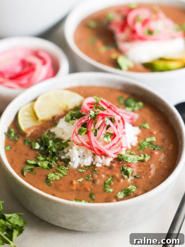 Delicious Sweet Potato Recipes for Every Meal 31 Black bean soup topped with colorful garnish.