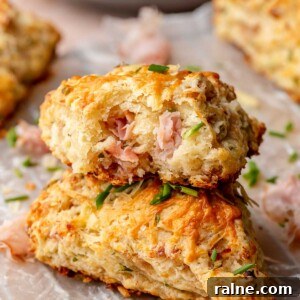 Savory Ham and Cheese Scones Recipe for Brunch or Snacks 18 A stack of ham and cheese scones. The top scone has a bite removed.