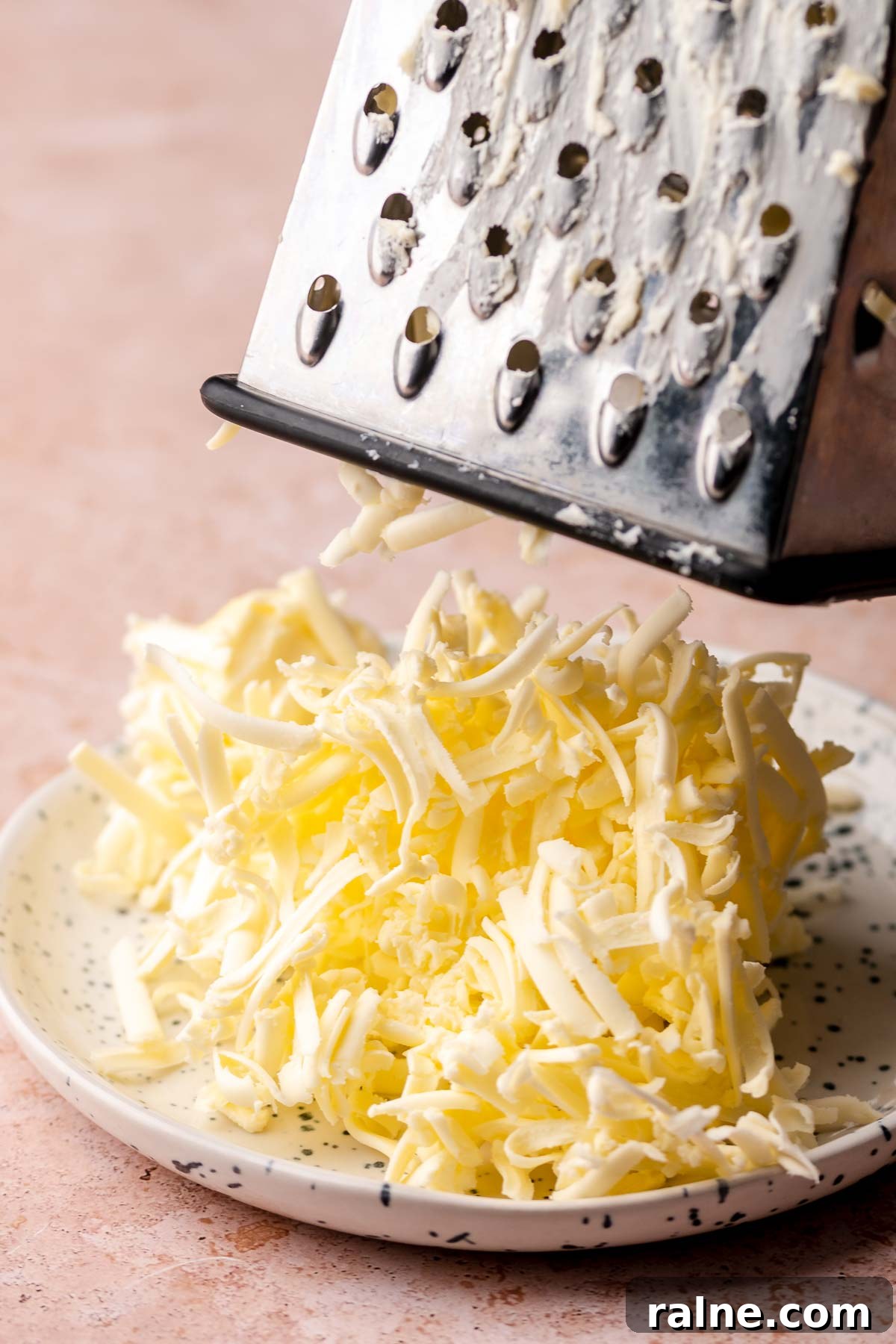 Savory Ham and Cheese Scones Recipe for Brunch or Snacks 4 Butter grated on a box grater.