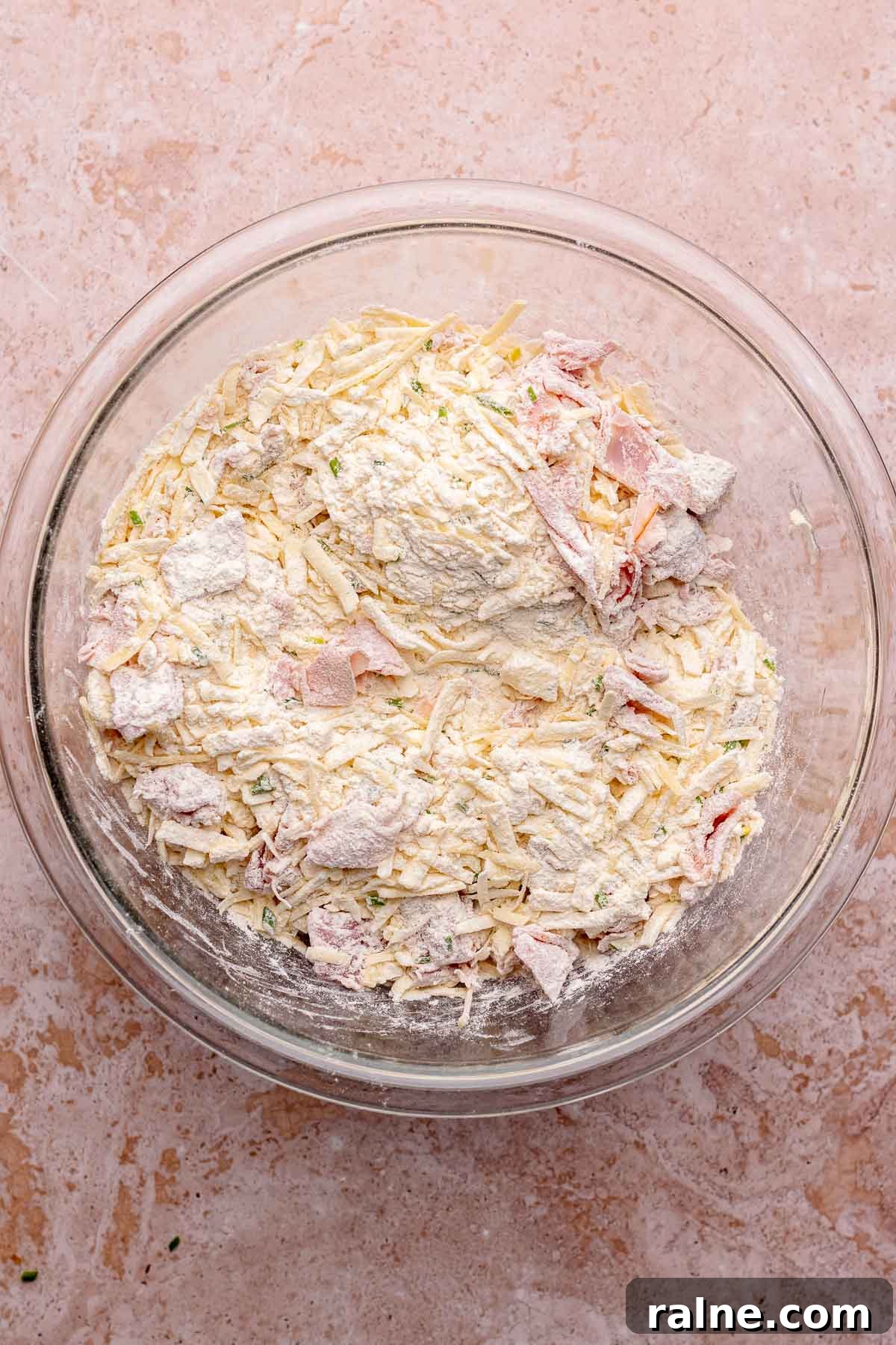 Savory Ham and Cheese Scones Recipe for Brunch or Snacks 6 All dry ingredients for ham and cheese scones combined in a bowl.