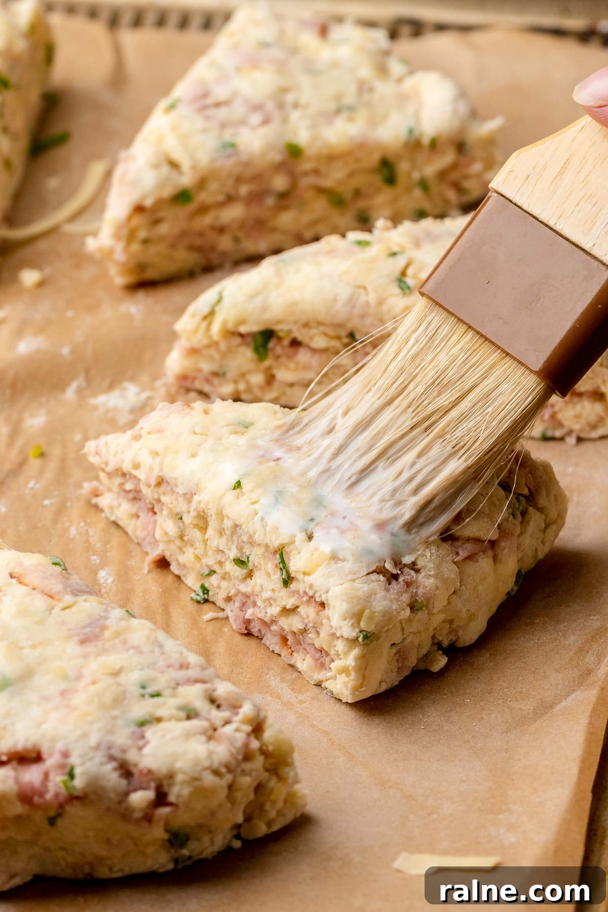 Savory Ham and Cheese Scones Recipe for Brunch or Snacks 10 A pastry brush adds milk on top of pre-baked scones.