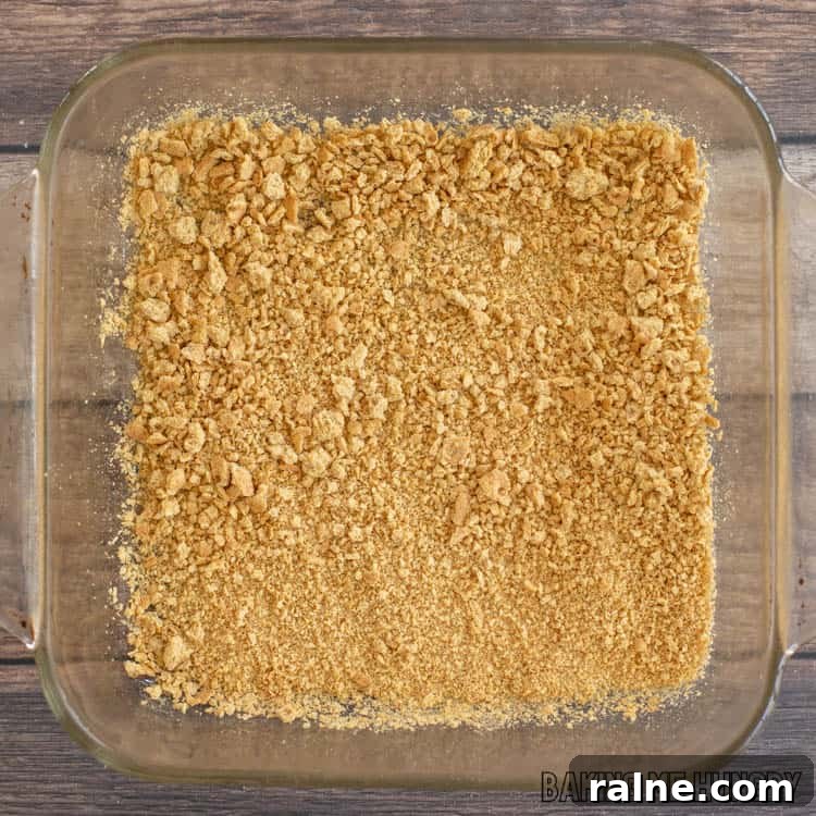 Decadent S'mores Casserole Recipe for Family Desserts 6 graham crackers crumbs in bottom of 8x8 glass dish