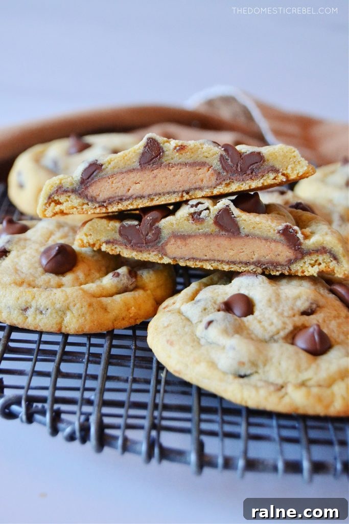 Peanut Butter Cup Stuffed Cookies: Gooey Chocolate Surprise 3 an assortment of peanut butter cup-stuffed cookies on a wire rack