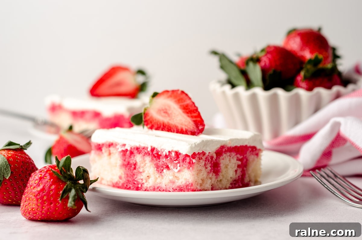 Strawberry Jello Poke Cake Recipe — Moist, Creamy Dessert 3 slice of strawberry poke cake on a plate