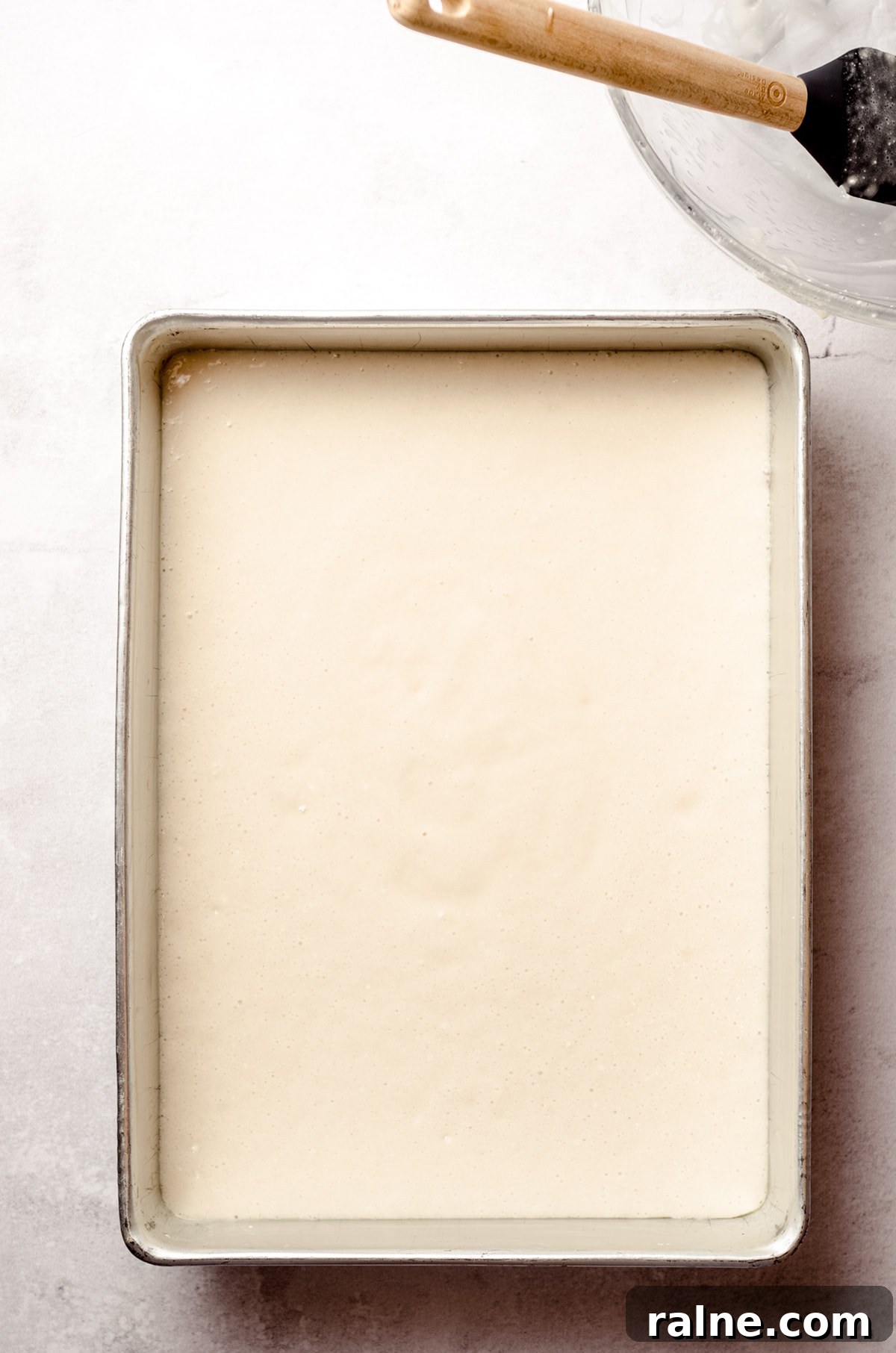 Strawberry Jello Poke Cake Recipe — Moist, Creamy Dessert 6 batter for white sheet cake in a pan