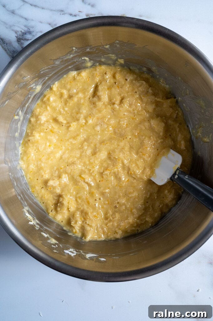 Orange Semolina Cake (Portokalopita) 10 Mixing in the phyllo for the Portokalopita