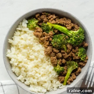 top down shot of paleo beef and broccoli stir fry in a gray bowl