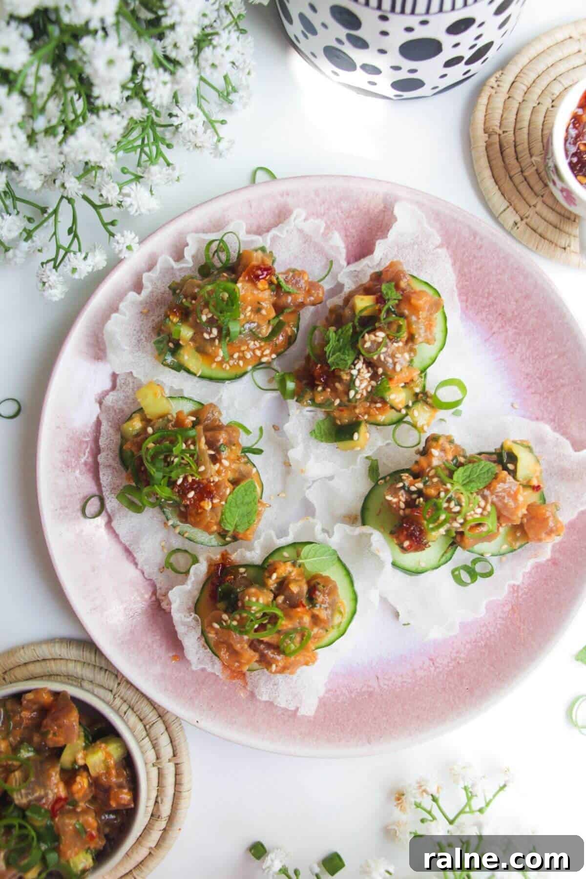 Spicy Tuna Crispy Rice Paper Cups Recipe for Impressing Guests 2 Five tuna rice paper cups on a pink plate.