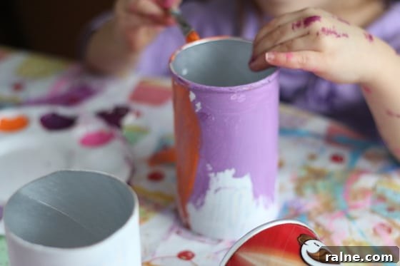 DIY Pringles Can Binoculars: Fun Craft Project for Preschoolers 3 child painting Pringles can
