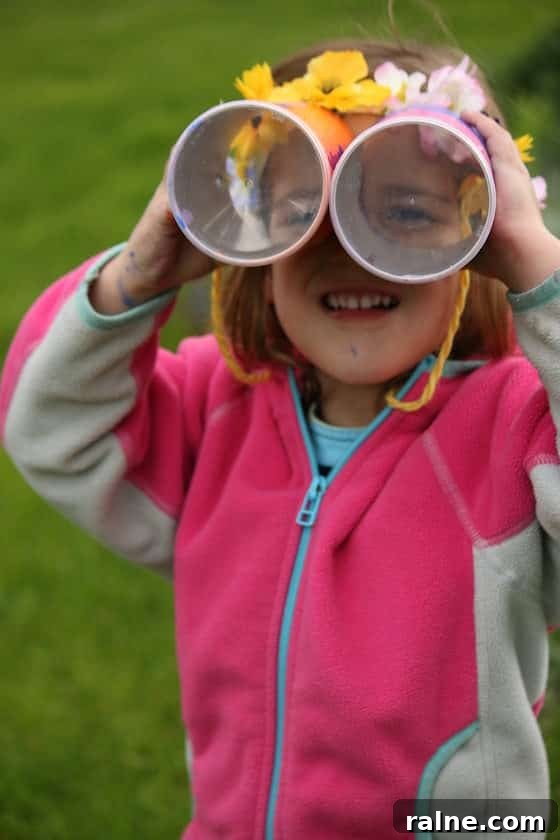 DIY Pringles Can Binoculars: Fun Craft Project for Preschoolers 9 child looking through pringles cans