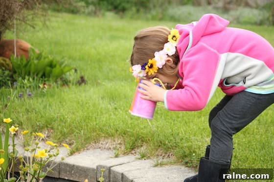 DIY Pringles Can Binoculars: Fun Craft Project for Preschoolers 10 child looking into pond through homemade toy binoculars