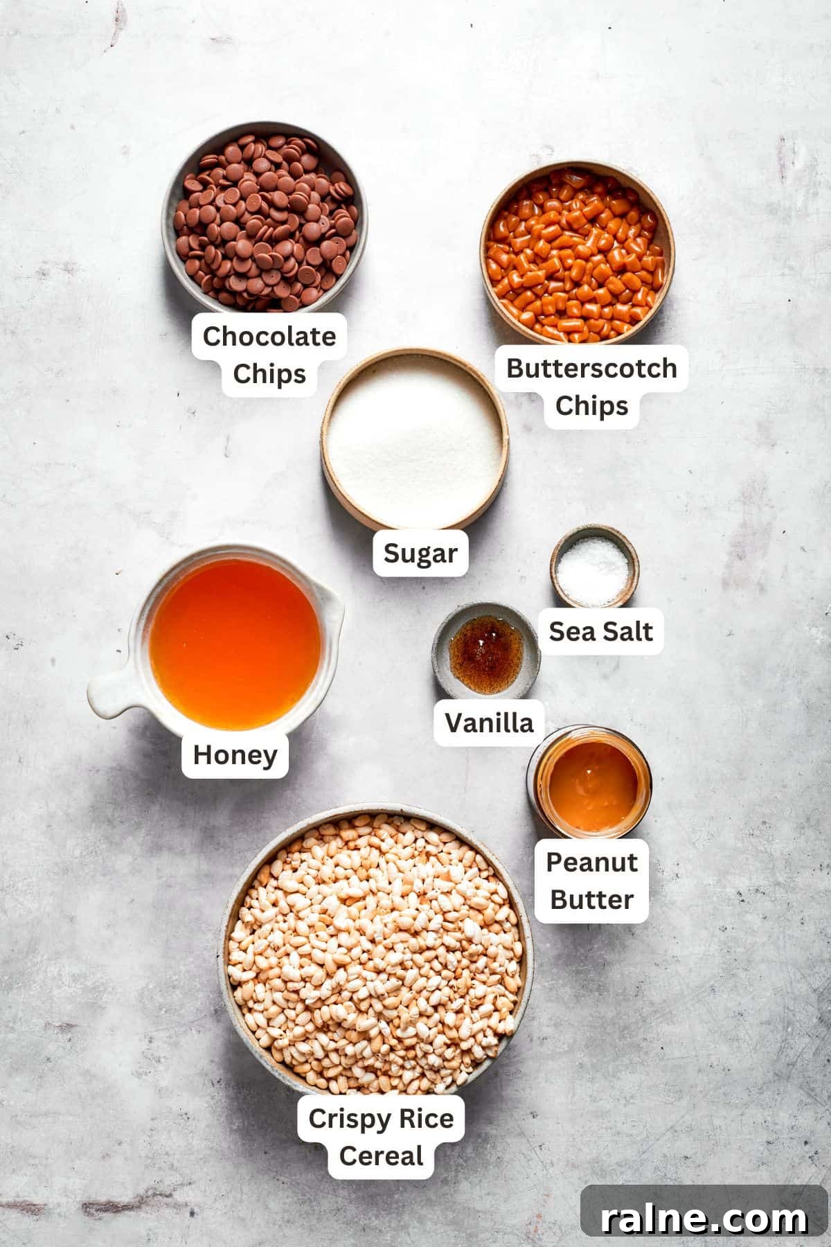 No-bake scotcharoos feature creamy peanut butter, crispy rice cereal, and a sweet layer of melted chocolate and butterscotch. Ingredients for scotcharoos are text-labeled.