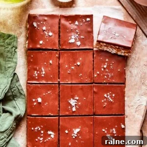 Scotcharoos Recipe: Peanut Butter, Butterscotch & Chocolate Squares 2 One dozen scotcharoos on a counter.