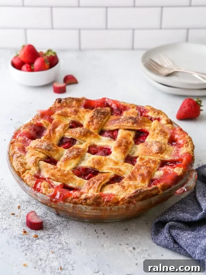 Top Pie-Making Tools Every Baker Should Own 14 strawberry rhubarb pie on table with stack of plates