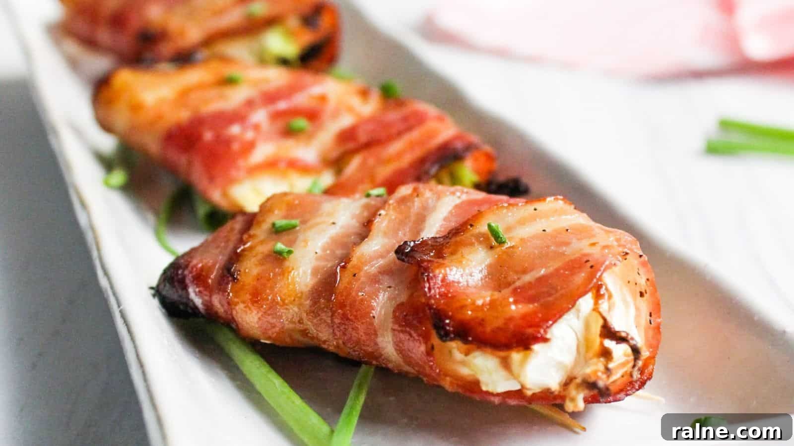 9 Simple Appetizers You Can Make With Just a Few Ingredients 8 Bacon wrapped air fryer cabbage on white plate.