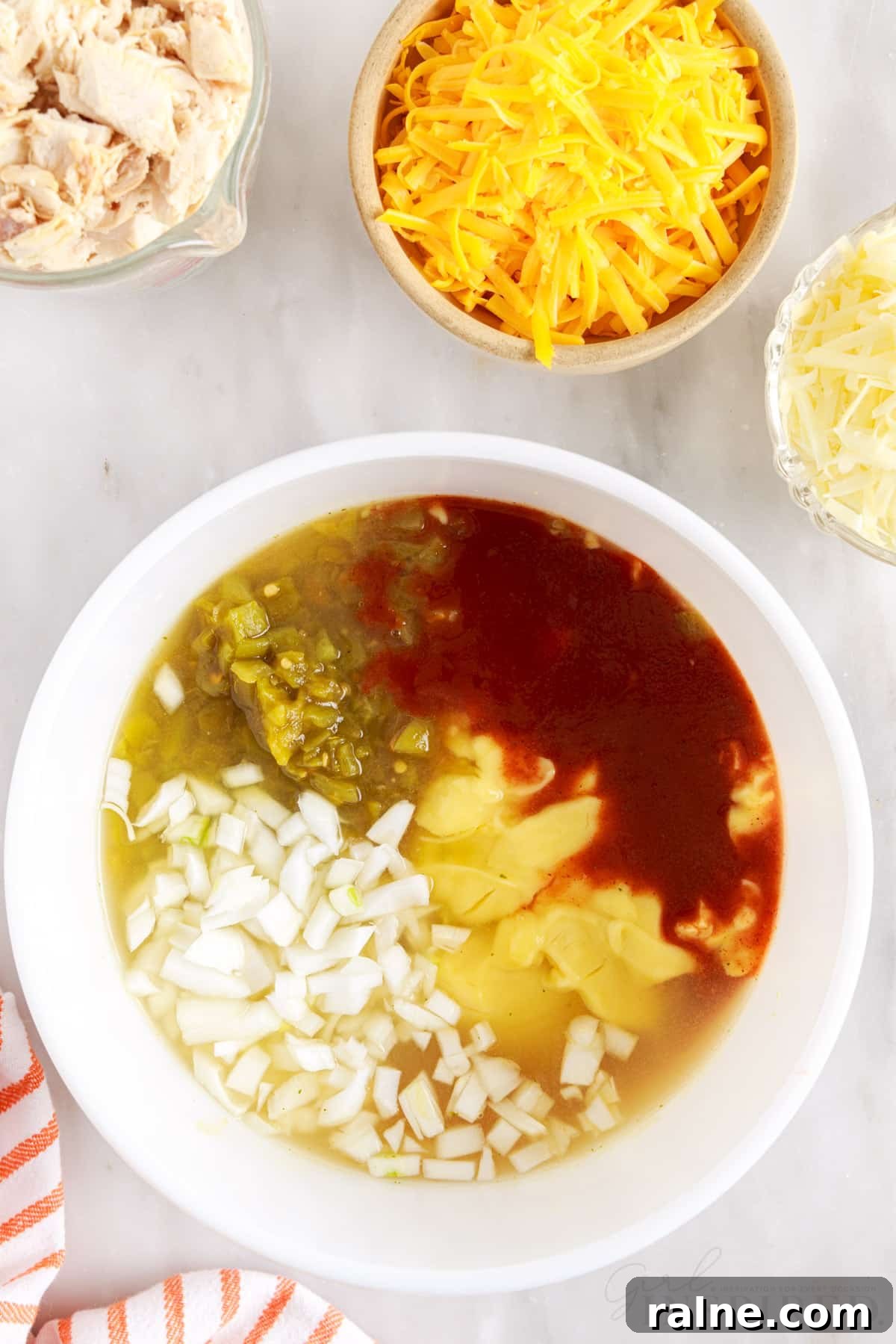 enchilada sauce chicken broth onions together in a large mixing bowl