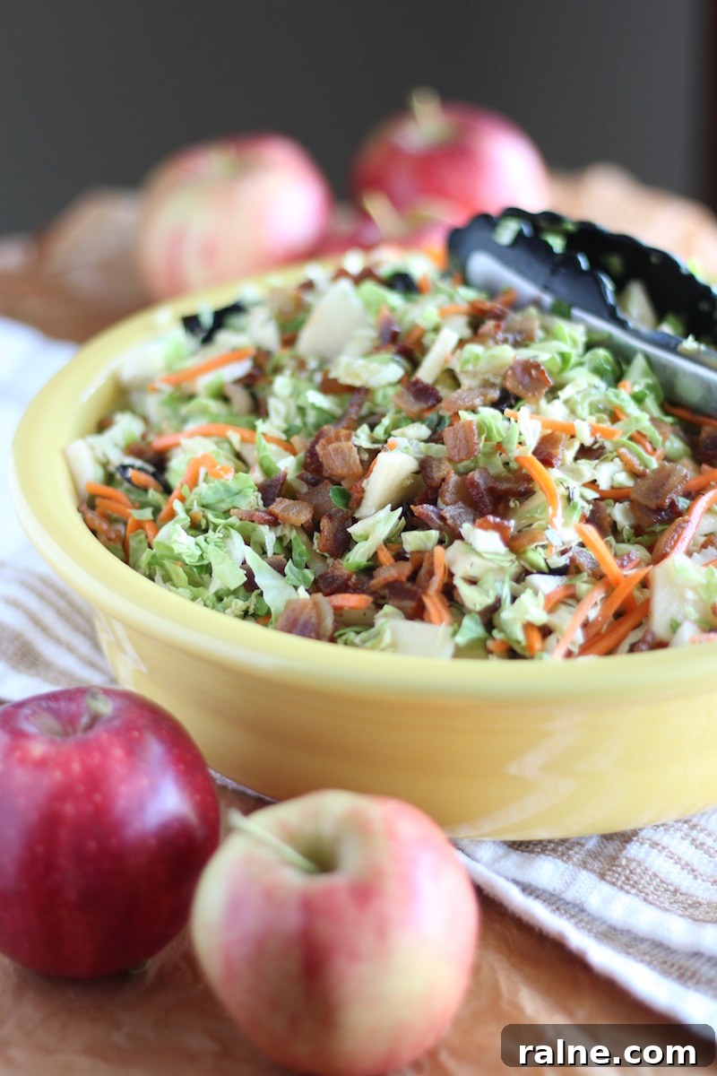 Apple Bacon Brussels Sprouts Salad - an AIP and Paleo Fall salad full of flavor from smoky bacon, sweet apples, dried cherries, and an apple cider bacon vinaigrette!