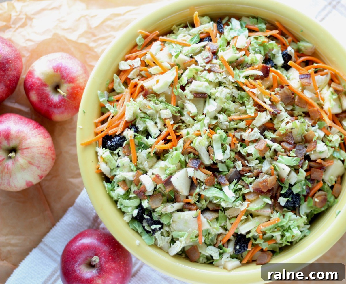 Apple Bacon Brussels Sprouts Salad - an AIP, Paleo Fall salad complete with shredded sprouts, crispy bacon, sweet apples, and an apple cider bacon vinaigrette!