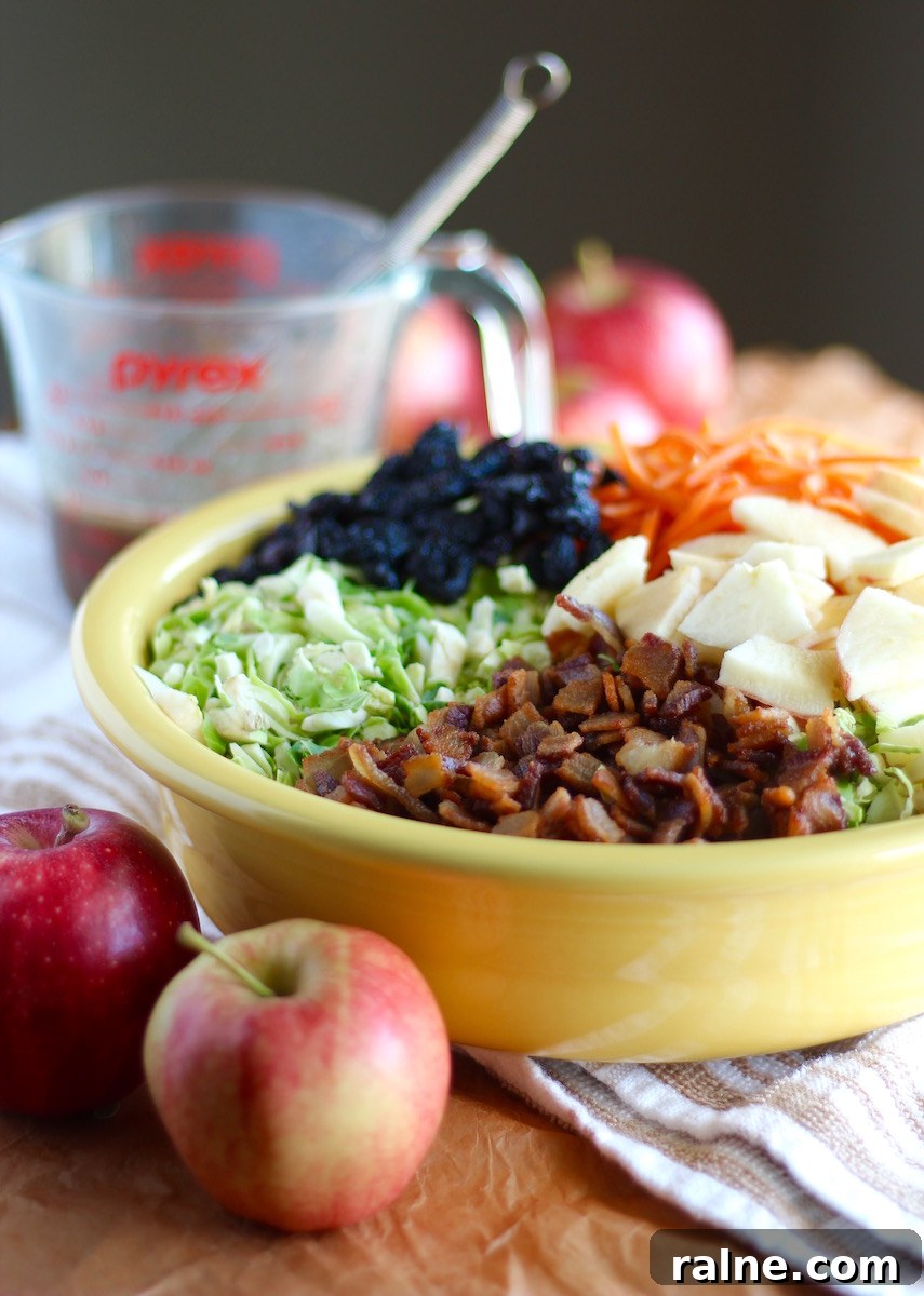 Apple Bacon Brussels Sprouts Salad - an AIP, paleo salad with Fall flavors, featuring apples, bacon, dried cherries, brussels sprouts, and an apple cider vinaigrette!