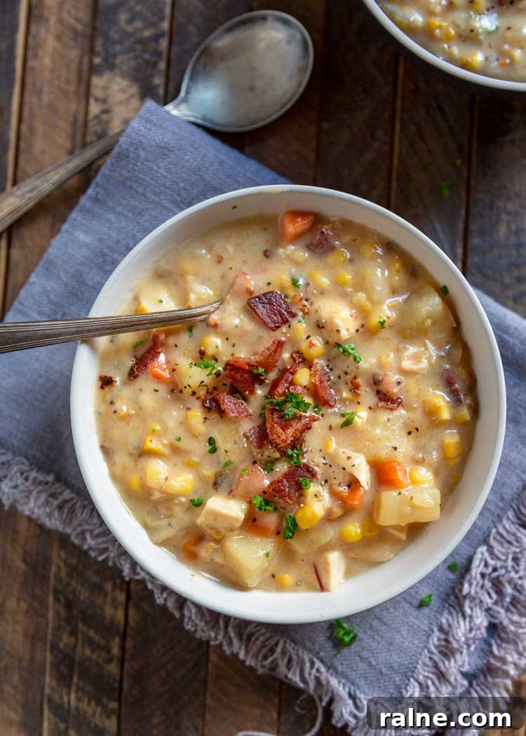 Thick and creamy with chunks of potatoes, corn and carrots, this Southwest Slow Cooker Corn Chowder gets a kick from the chipotle pepper and uses no cream! Southwest Slow Cooker Corn Chowder