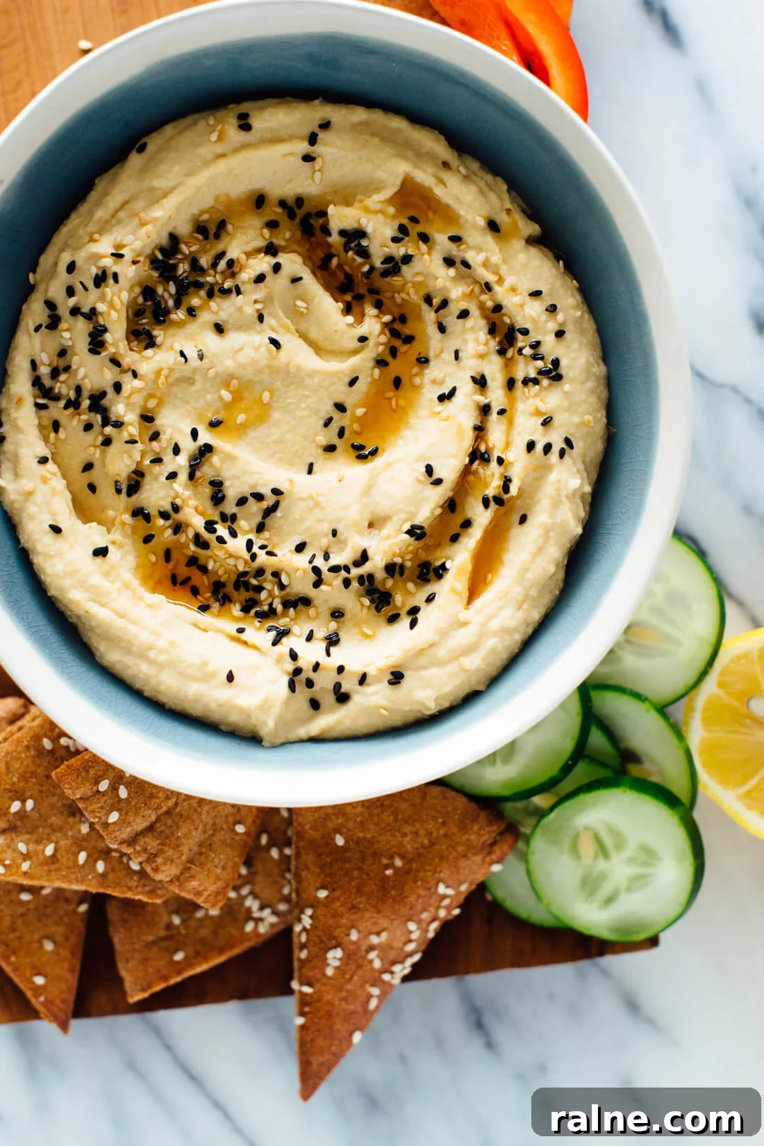 Toasted Sesame Hummus Recipe: Creamy Tahini-Infused Dip 2 This toasted sesame hummus recipe includes toasted sesame oil and toasted sesame seeds on top! You're going to love it.
