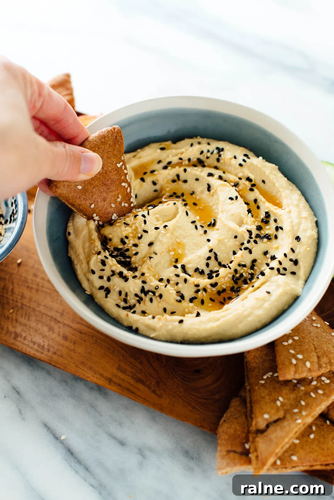 Toasted Sesame Hummus Recipe: Creamy Tahini-Infused Dip 7 This creamy hummus recipe is made with extra sesame! Toasted sesame oil and sesame seeds, in addition to tahini, makes this dip irresistible.
