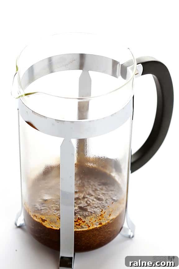 Measured coffee beans and French press
