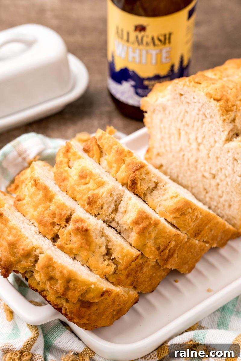 No-Fuss Beer Bread Recipe: Crispy Crust, Tender Inside 2 beer bread slices in front of a bottle of white ale