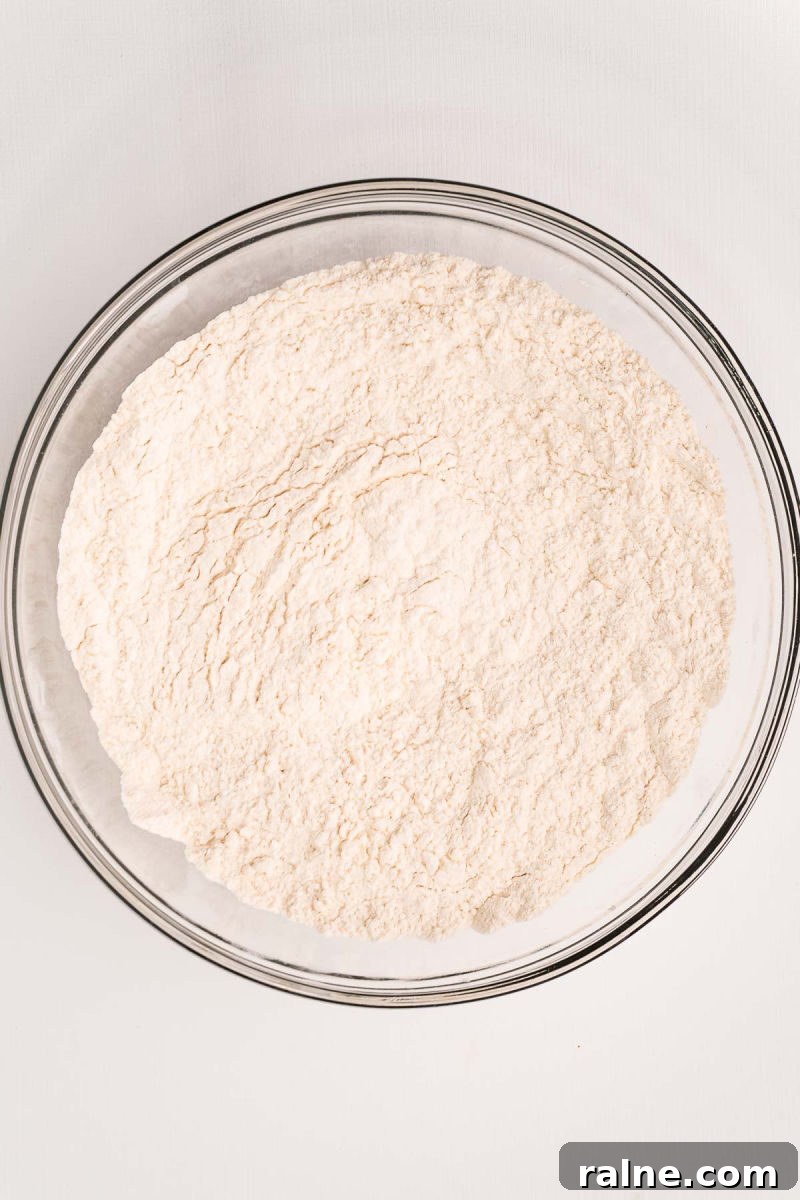 No-Fuss Beer Bread Recipe: Crispy Crust, Tender Inside 5 flour, sugar, and baking powder mixed together in a bowl