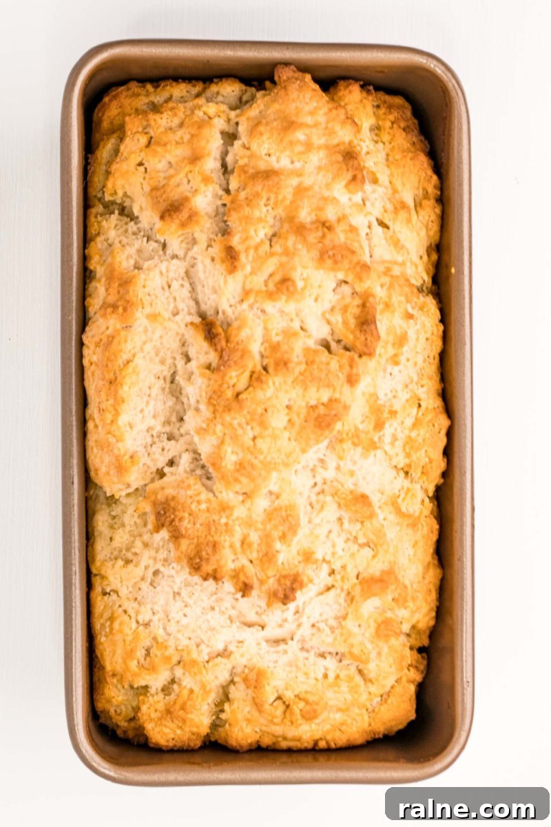 No-Fuss Beer Bread Recipe: Crispy Crust, Tender Inside 8 looking down at baked beer bread in a loaf pan