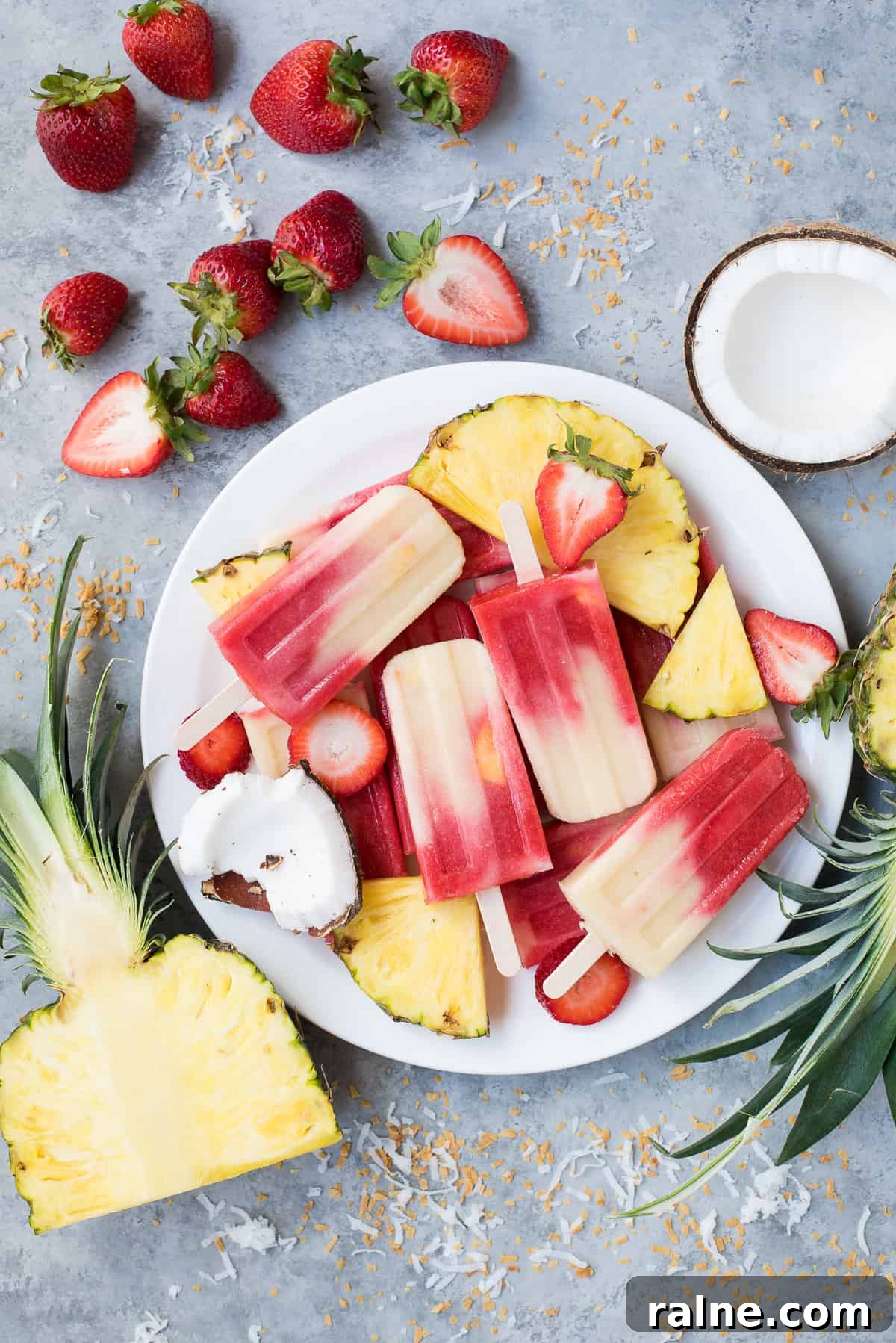 Miami Vice Mocktail Popsicles: Refreshing Raspberry Piña Colada Treats 4 Miami Vice popsicles on plate