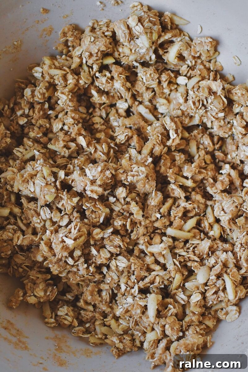 Butter, brown sugar, cinnamon, ginger, salt, and slivered almonds in a large bowl after mixing the crisp topping.
