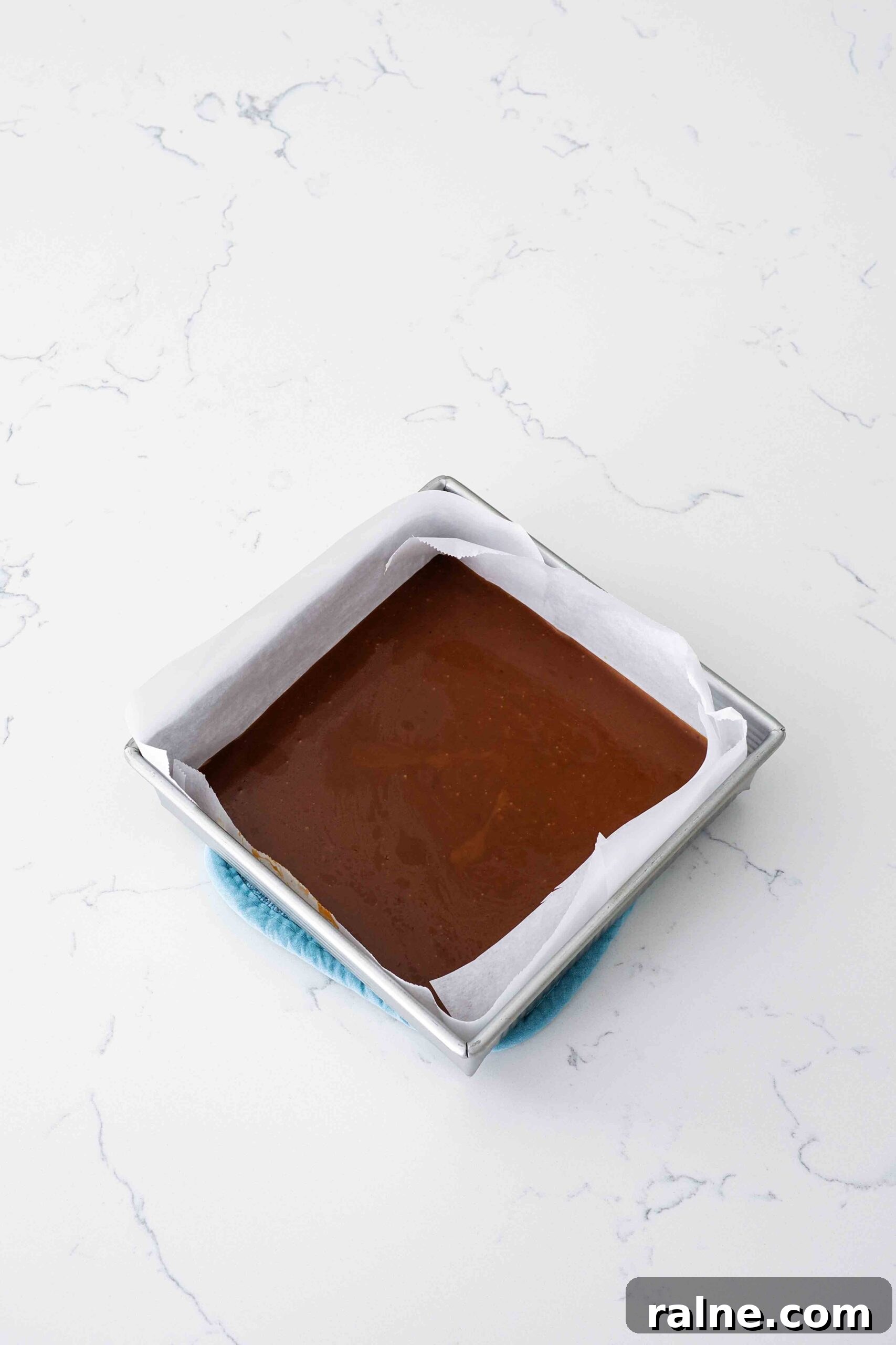 Pumpkin Spice Caramels Recipe: Homemade Fall Candy Guide 12 Pumpkin spice caramel sets in a square pan.
