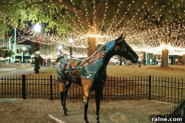 Top Winter Activities in Ocala & Marion County You Can’t Miss 4 A statue of a horse that is standing in front of a fence with Christmas lights in the background.