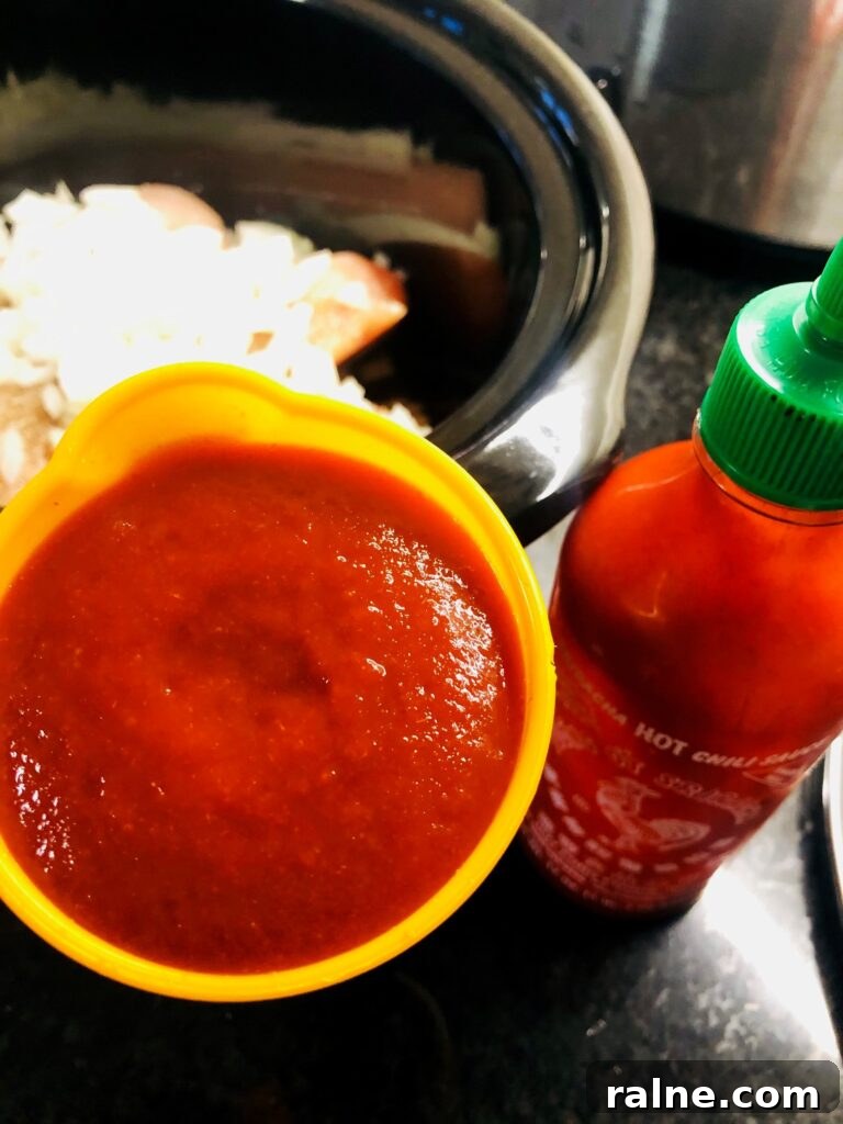 Sriracha Chicken Noodle Soup Made in the Slow Cooker 3 adding sriracha to slow cooker