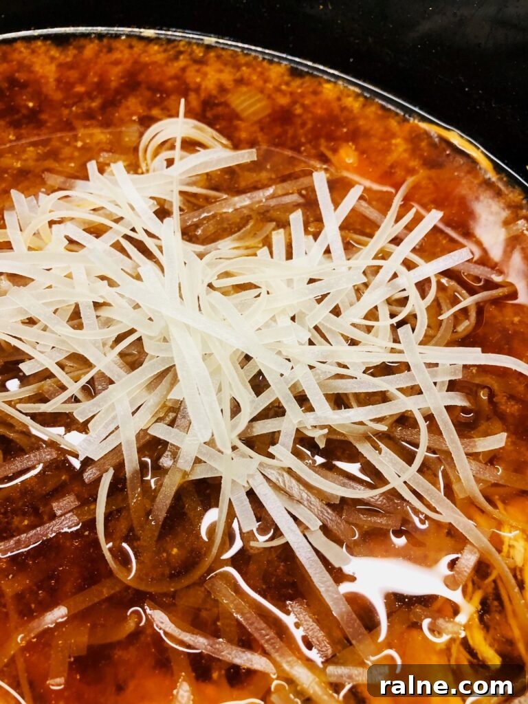 Sriracha Chicken Noodle Soup Made in the Slow Cooker 6 adding rice noodles to the soup