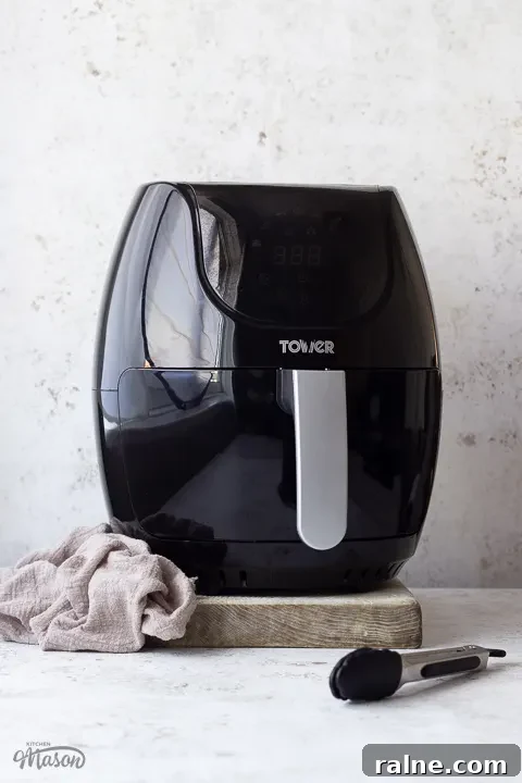 T17067 Tower Air Fryer Review: Real Results and Key Features 2 An air fryer with a pair of tongs