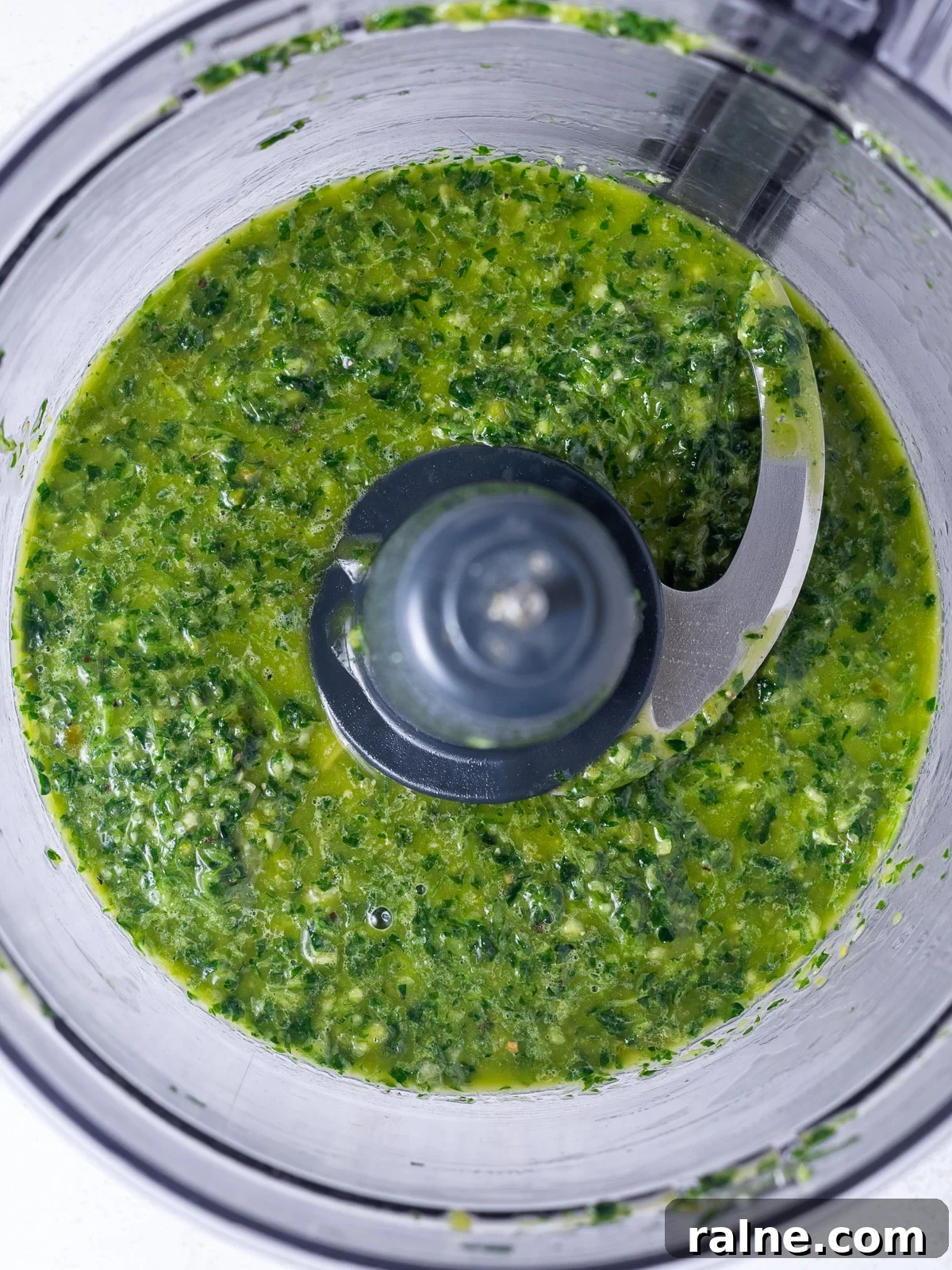Arugula Chimichurri Sauce Recipe for Grilled Meats & Veggies 6 food processor bowl with the blended chimichurri