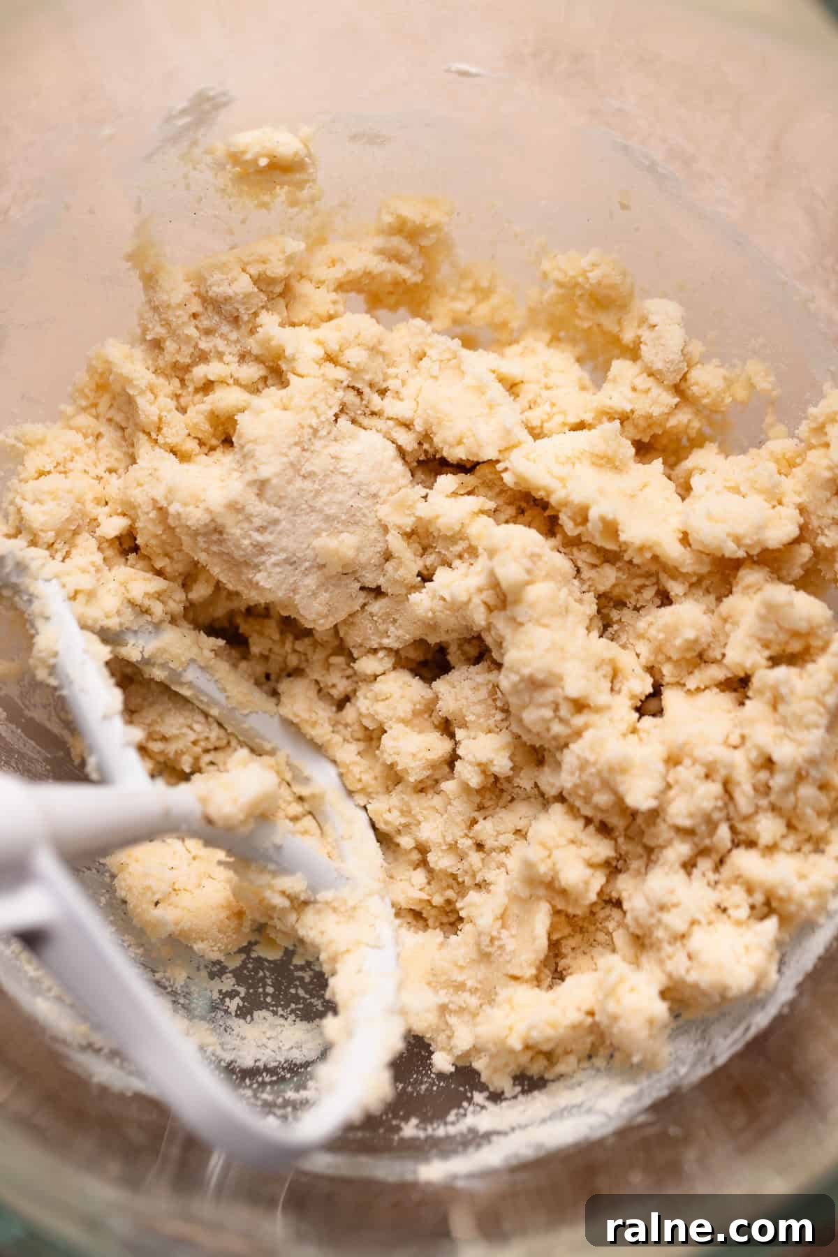 Classic Lemon Bars with Buttery Shortbread Crust 3 Shortbread dough in a glass mixer bowl.