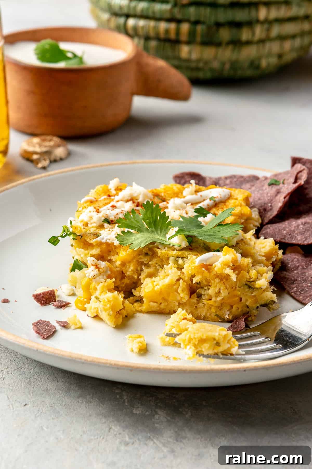 Creamy Mexican Corn Casserole with Cheesy Jalapeño Bake 8 Square of Mexican corn casserole served on a plate.