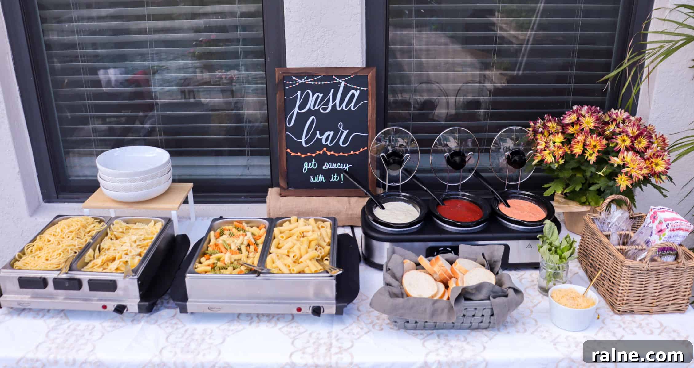 Party Pasta Bar Ideas: How to Set Up a Crowd-Pleasing Pasta Station 2 Pastas with three sauces on long buffet table for pasta party.