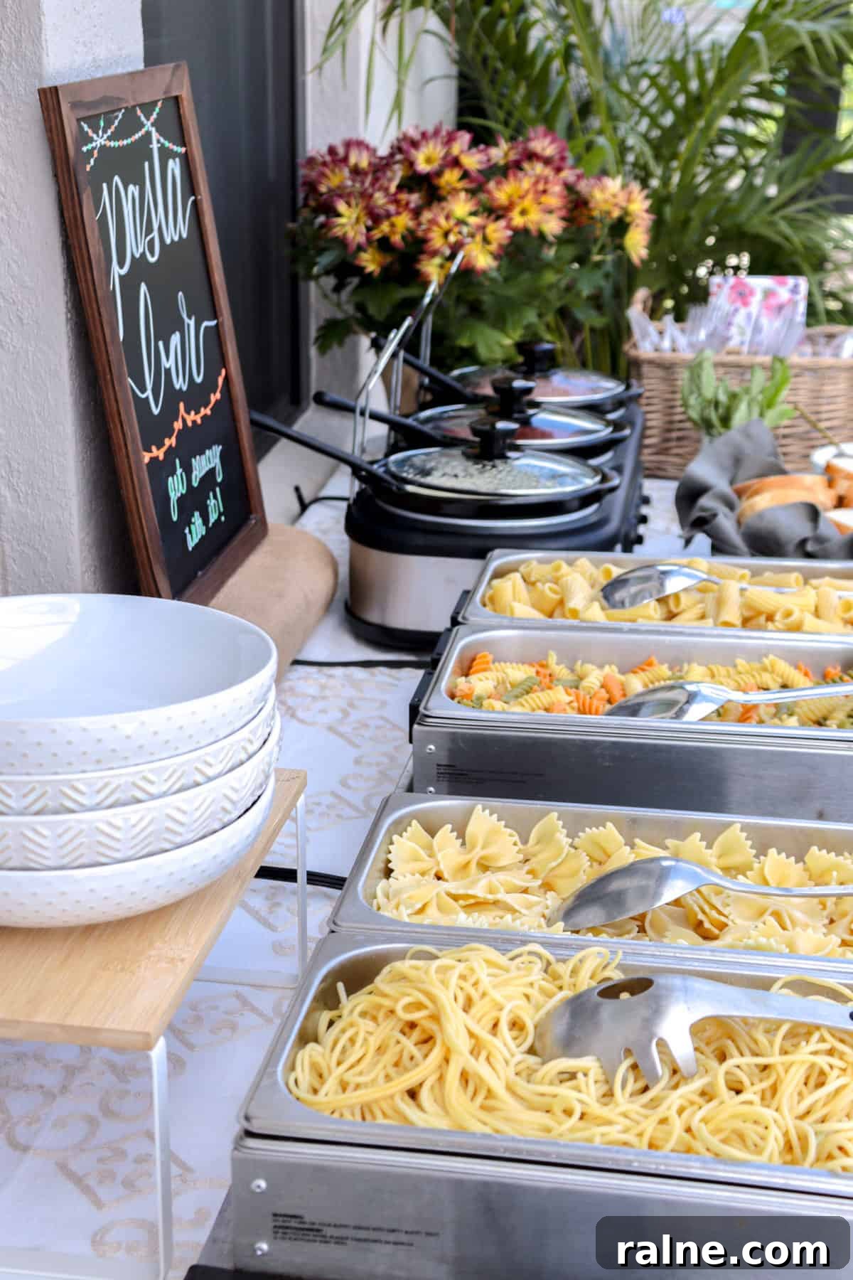 Party Pasta Bar Ideas: How to Set Up a Crowd-Pleasing Pasta Station 3 Pasta ready to be served in chafing dishes.