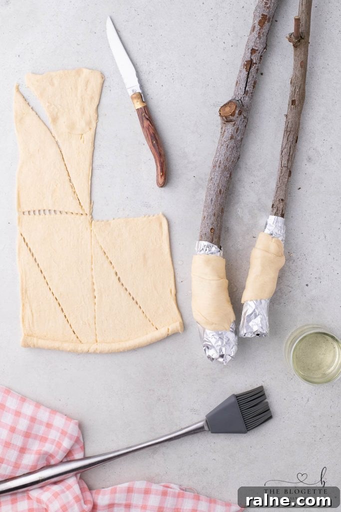 Campfire Éclairs: How to Make Gooey Chocolate-Filled Treats Over a Fire 6 Pastry around a stick