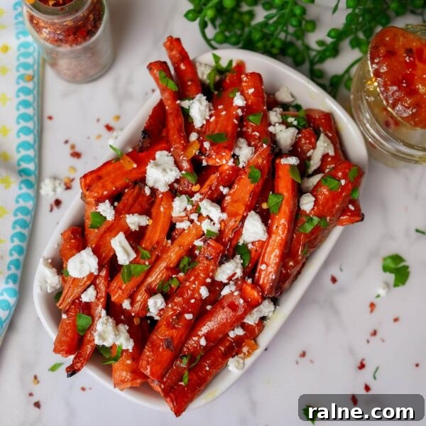 11 Flavorful Ways to Season Vegetables for Every Meal 6 roasted carrot spears with cheese and parsley on white serving plate