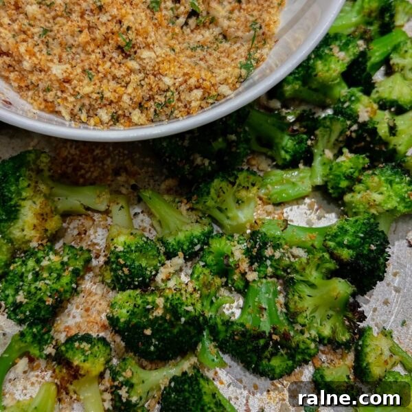 11 Flavorful Ways to Season Vegetables for Every Meal 9 oven roasted broccoli with a bowl of herbed breadcrumbs in corner